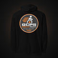 Back of the black GCPS Mobility Project Hoodie with a large orange, gray and white GCPS Mobility Project badge reading "One Chair. Every Month."