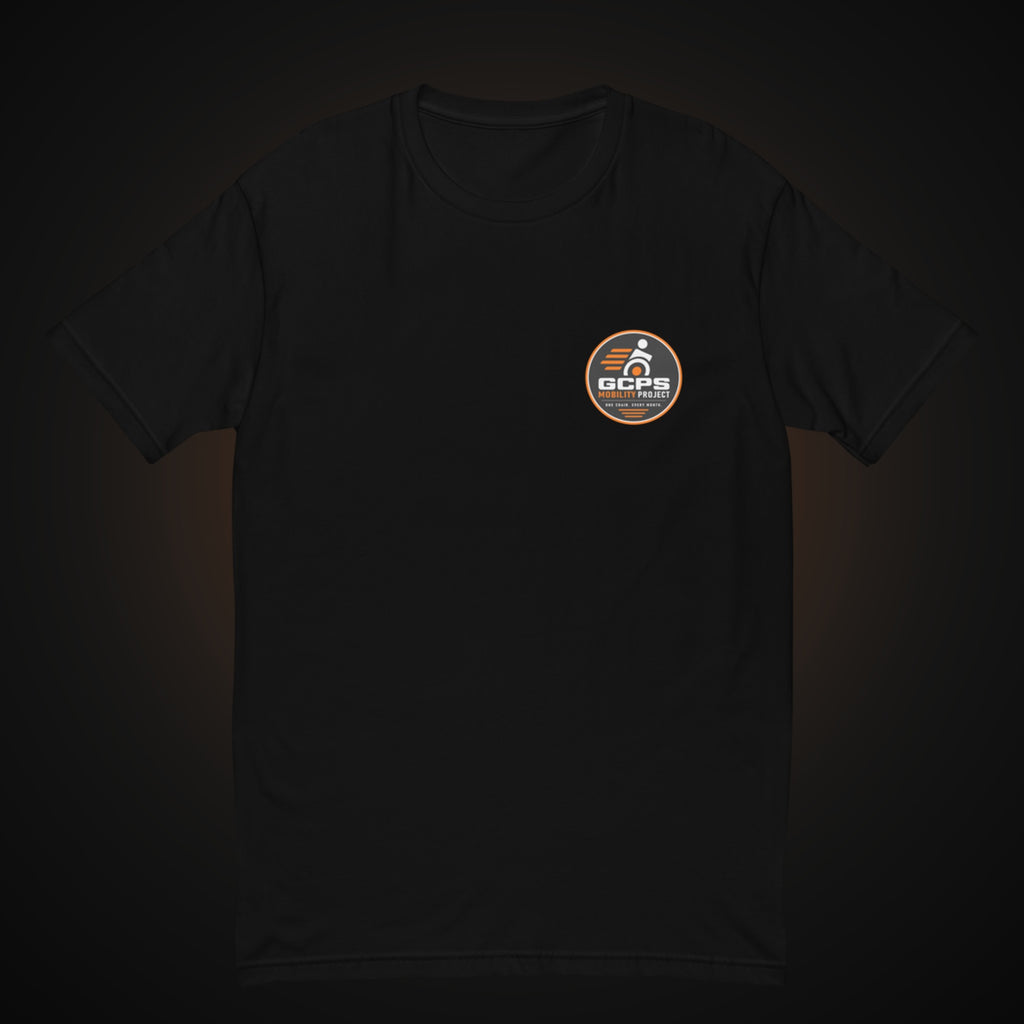 Front of the black GCPS Mobility Project T-Shirt with a small GCPS Mobility Project badge on the left chest