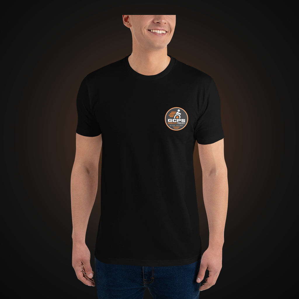 Person wearing the black GCPS Mobility Project T-Shirt, front view with the left chest badge